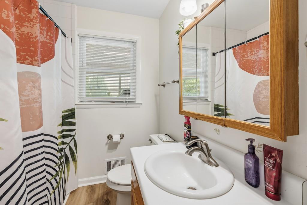 374 Dacula Road Dacula, GA 30019 - Photo 14 of 20 a bathroom with a sink a toilet and a mirror