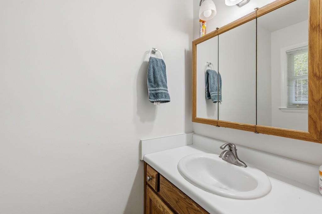 374 Dacula Road Dacula, GA 30019 - Photo 17 of 20 a bathroom with a sink and a mirror