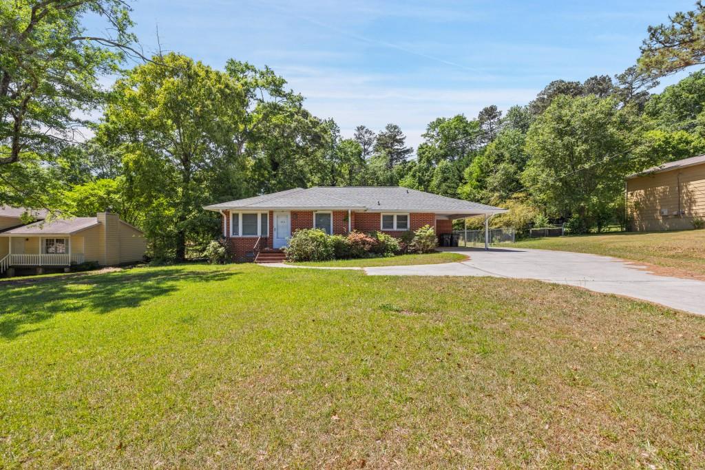 374 Dacula Road Dacula, GA 30019 - Photo 2 of 20 a house with swimming pool in front of it
