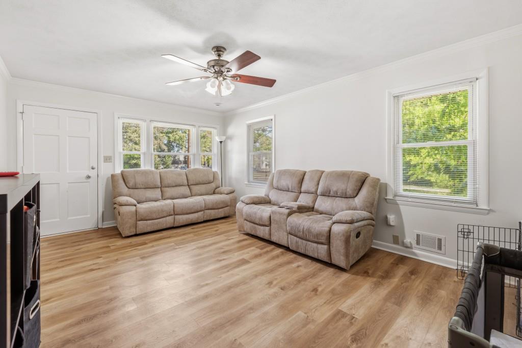 374 Dacula Road Dacula, GA 30019 - Photo 4 of 20 a living room with furniture and a large window