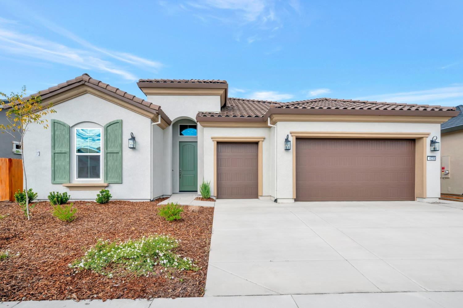 4330 Hooded Crow Way Rancho Cordova, CA 95742 - Photo 1 of 1 a front view of a house with a yard and garage