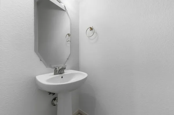 a bathroom with a sink and mirror