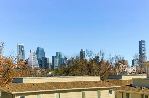 a view of a city with tall buildings
