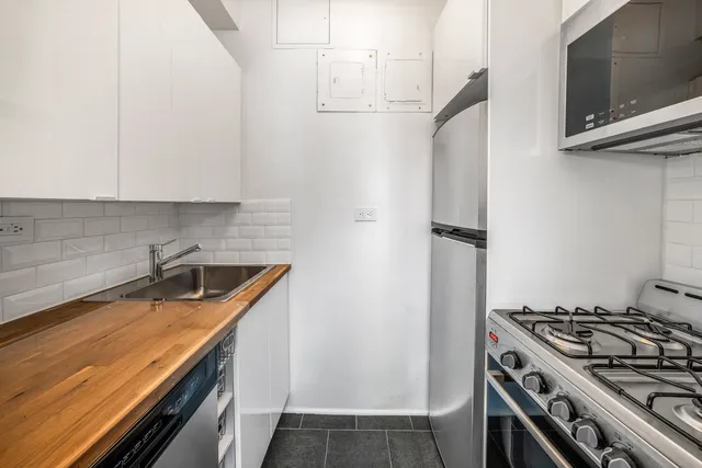 a bedroom with a bed and a flat screen television