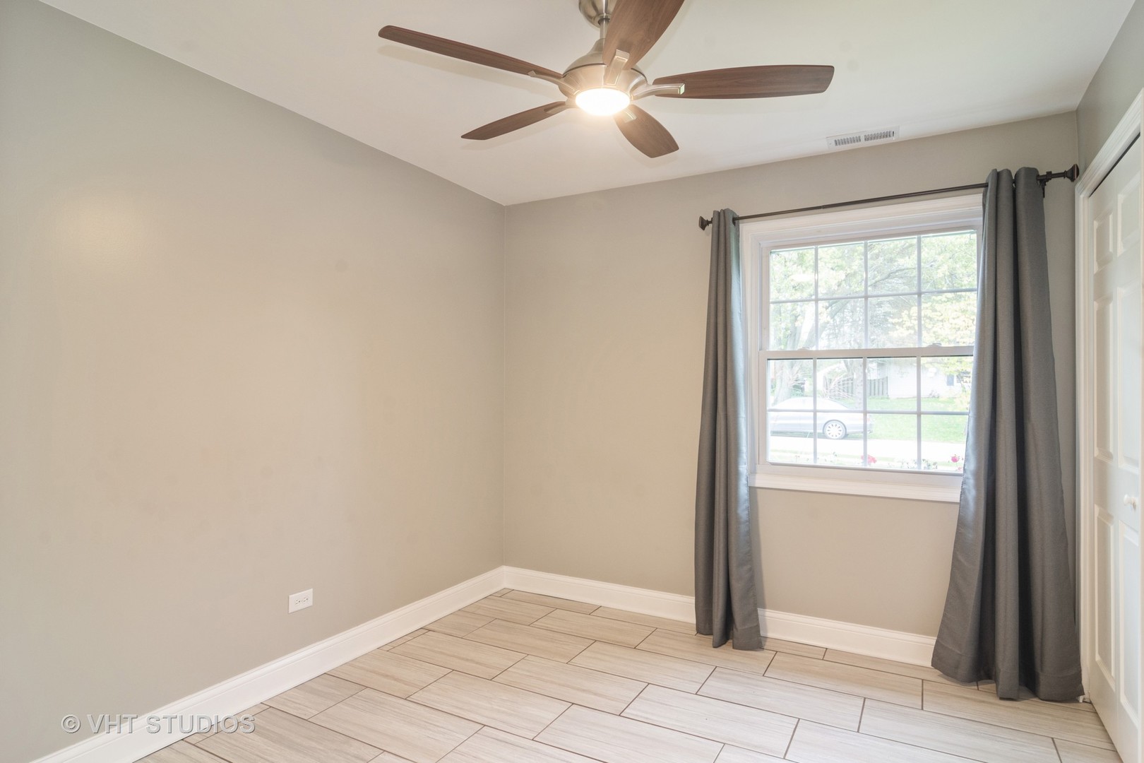 422 Glen Garry Road Cary, IL 60013 - Photo 10 of 12 wooden floor in an empty room with a window