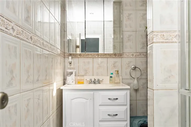 a bathroom with a sink and a window