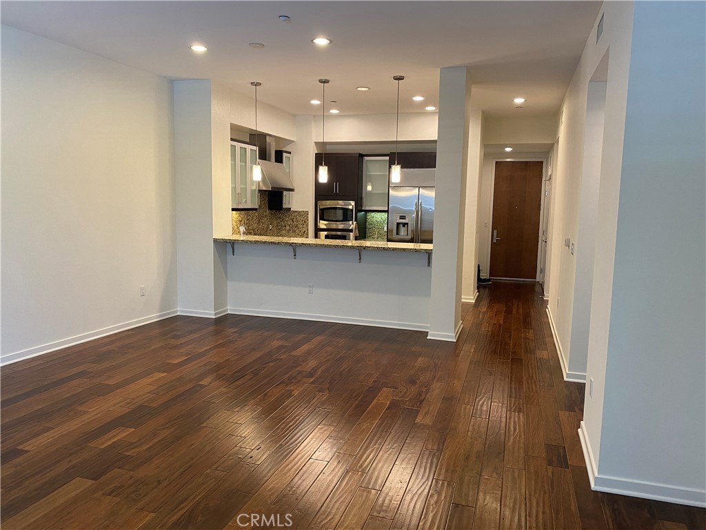 21 Gramercy, Unit 116 Irvine, CA 92612 - Photo 1 of 9 a view of kitchen with cabinets and wooden floor