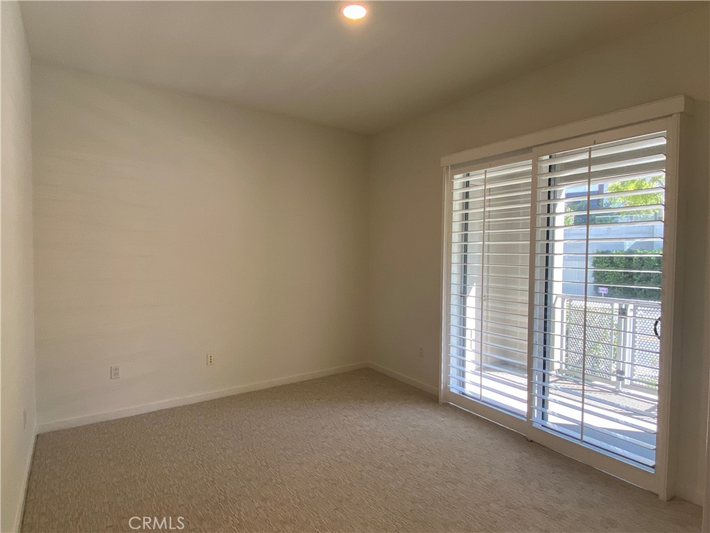 21 Gramercy, Unit 116 Irvine, CA 92612 - Photo 4 of 9 a view of an empty room with a window