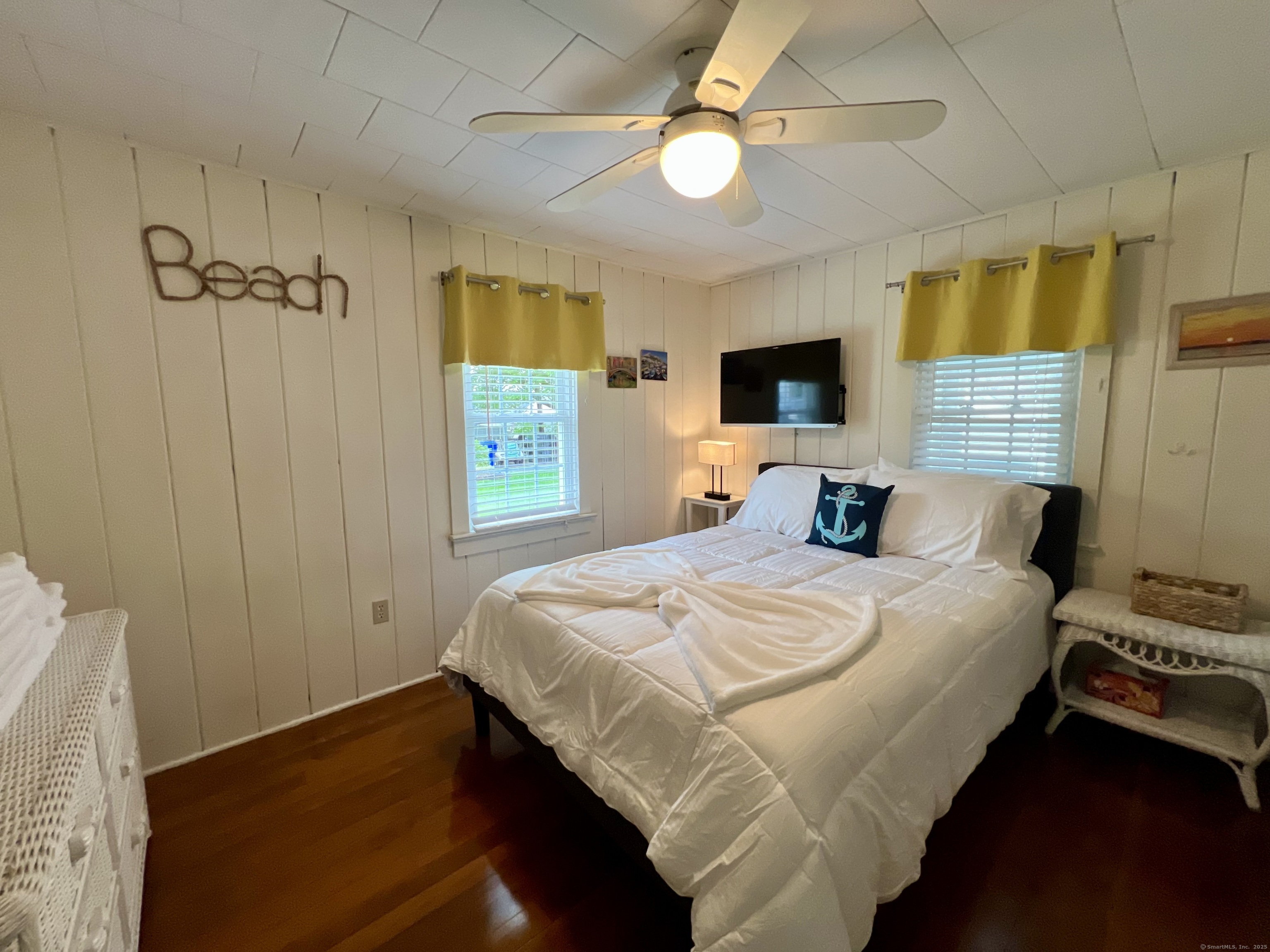 38 Seabreeze Road Old Saybrook, CT 06475 - Photo 18 of 19 a bedroom with a bed and a tv