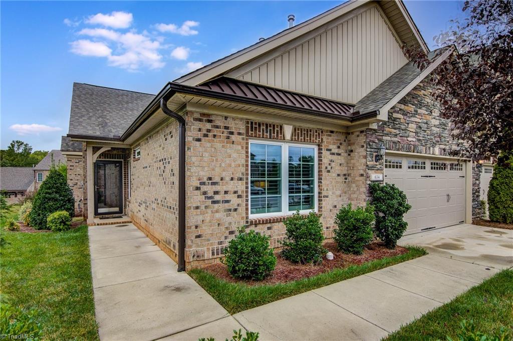 634 Nikyle Circle High Point, NC 27265 - Photo 1 of 32 Welcome to this beautiful brick and stone townhome in the Trellises. The neighborhood has great amenities with a clubhouse, pool, and fitness area. One level living at its best with many upgrades