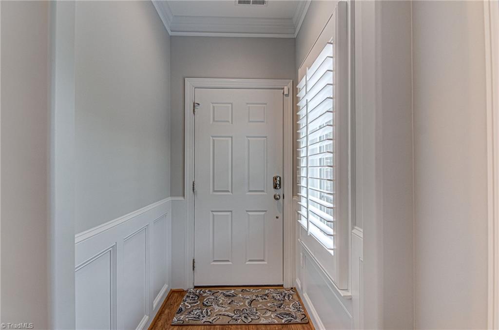 634 Nikyle Circle High Point, NC 27265 - Photo 2 of 32 Wainscoting and neutral colors meet you as you enter the home.
