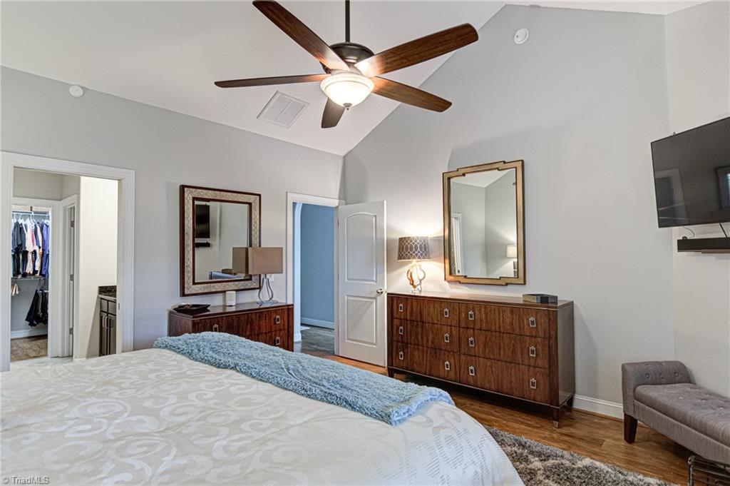 634 Nikyle Circle High Point, NC 27265 - Photo 16 of 32 The Primary bedroom suite with primary bath and walk-in closet. The townhome can be purchased furnished as all furniture and most accessories are available.