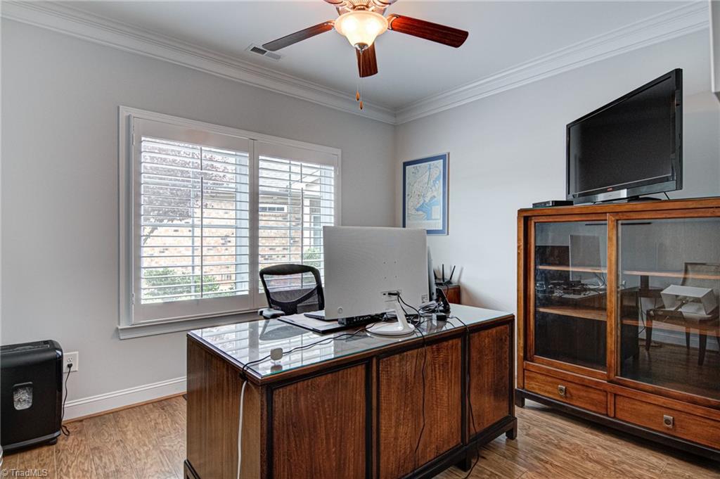 634 Nikyle Circle High Point, NC 27265 - Photo 20 of 32 Bedroom 3 makes the perfect home office or study. The TV will convey with the home. Again, this office furniture is available for purchase. Seller prefers to sell the home completely furninished.