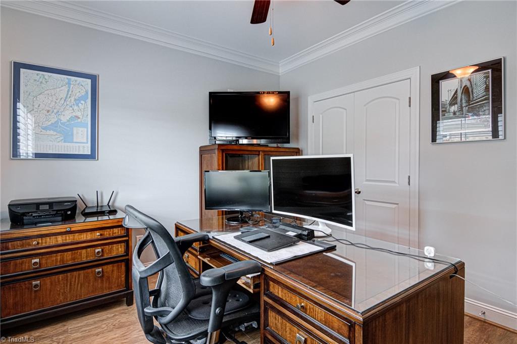 634 Nikyle Circle High Point, NC 27265 - Photo 21 of 32 Bedroom 3/Home Office with engineered flooring, crown molding and plenty of closet space.