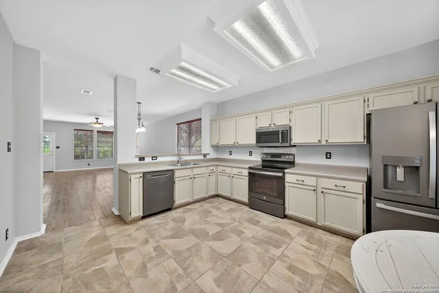 a bathroom with a toilet sink and shower