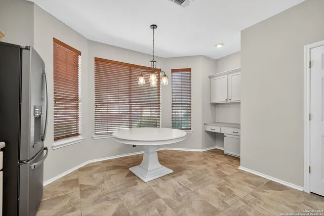 a view of a big room with carpet