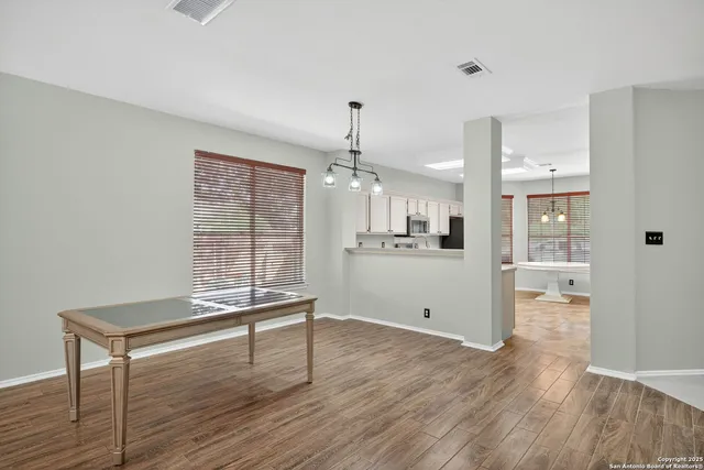 a kitchen with a sink stove and refrigerator