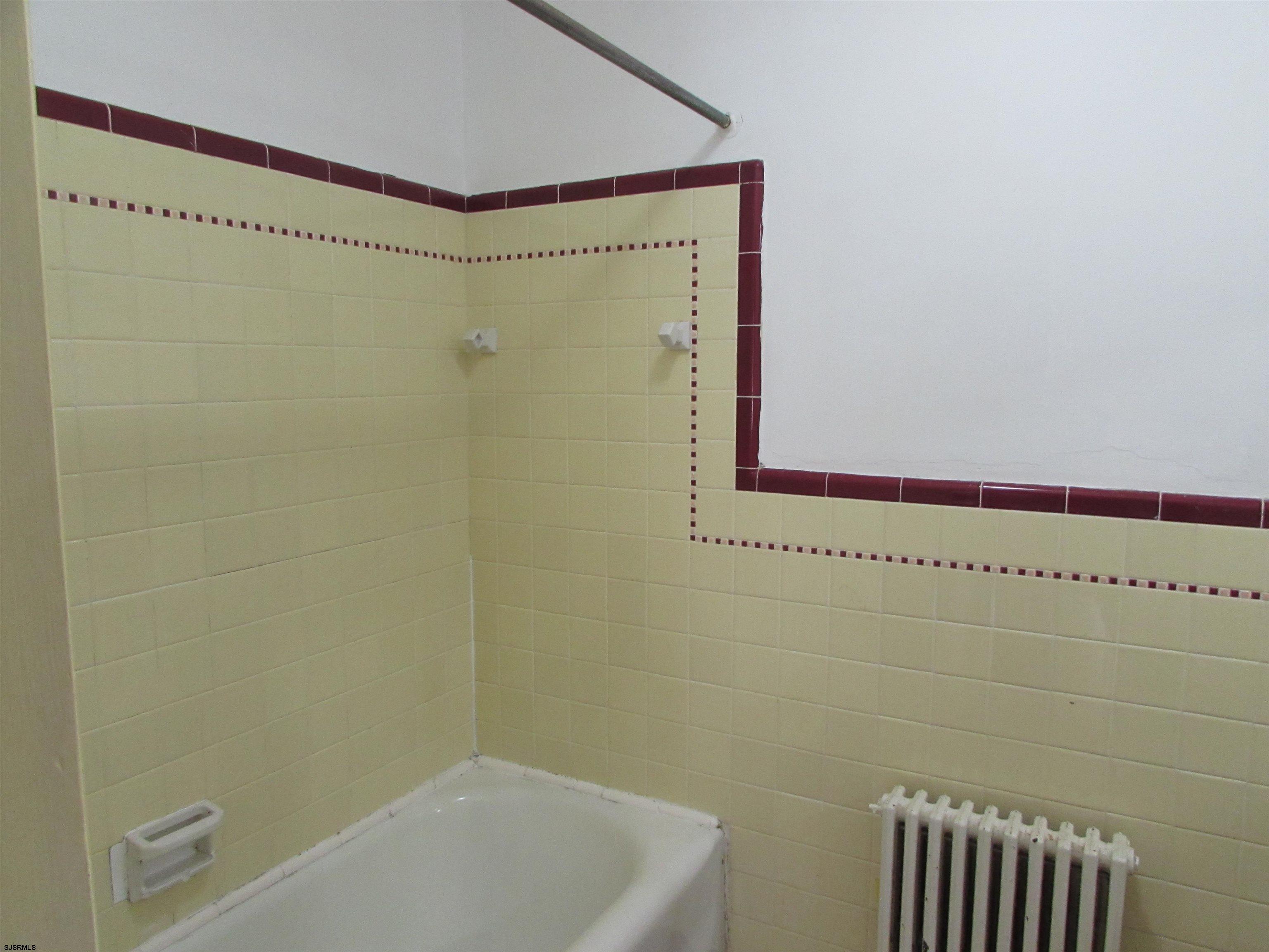 744 Shore Road Linwood, NJ 08221 - Photo 31 of 43 a bathroom with a shower and a bathtub