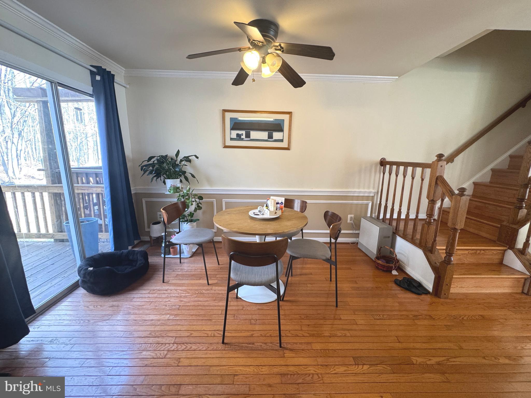 8732 Stone Hill Place Springfield, VA 22153 - Photo 11 of 28 a view of a dining room with furniture window and wooden floor