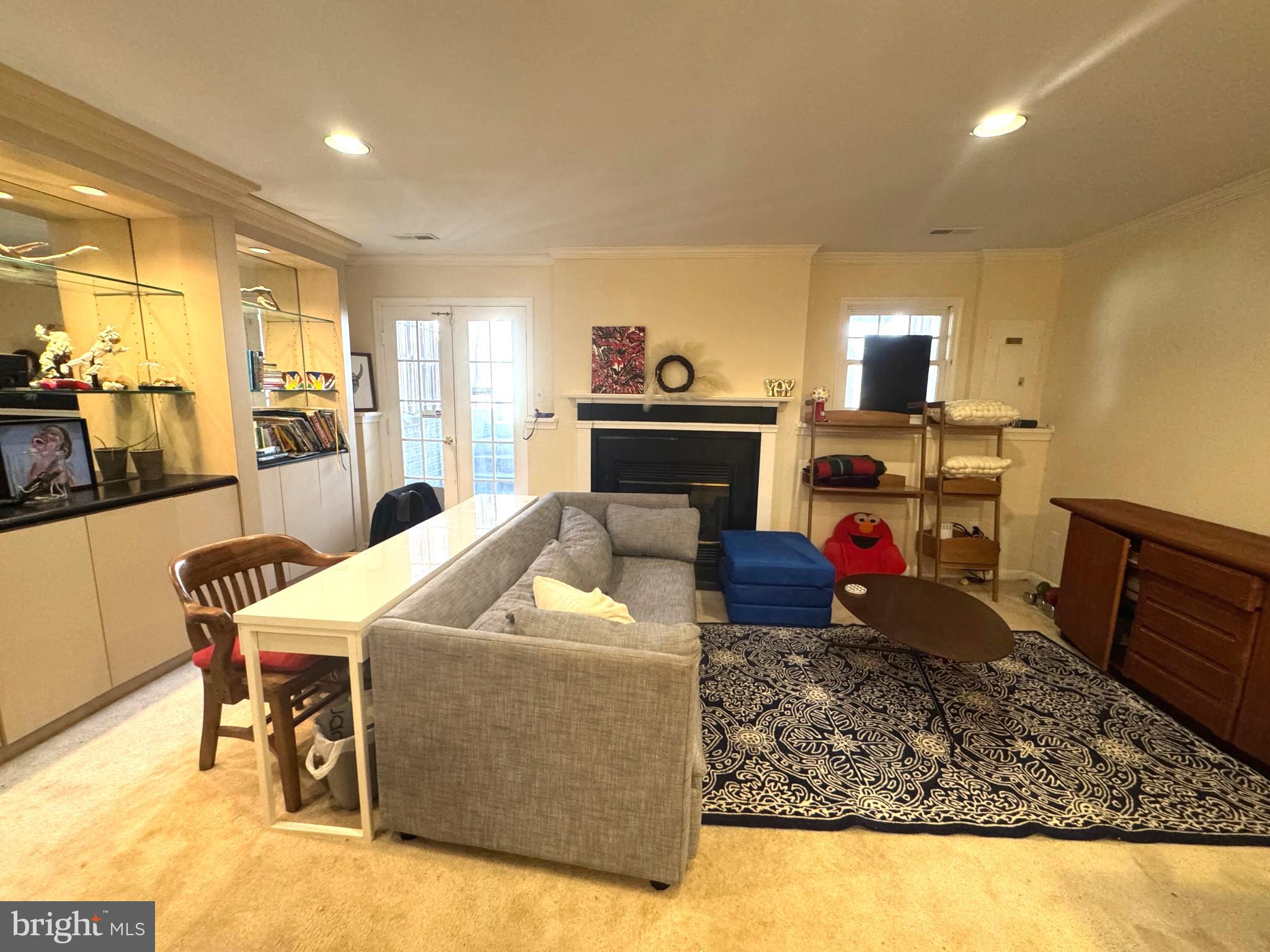 8732 Stone Hill Place Springfield, VA 22153 - Photo 24 of 28 a living room with furniture and a wooden floor