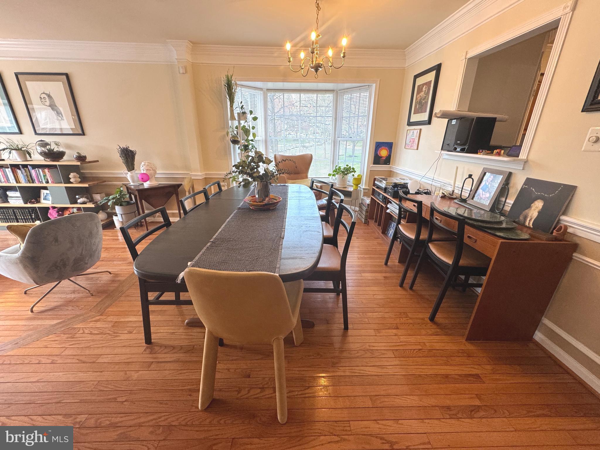 8732 Stone Hill Place Springfield, VA 22153 - Photo 5 of 28 a view of a dining room with furniture window and wooden floor