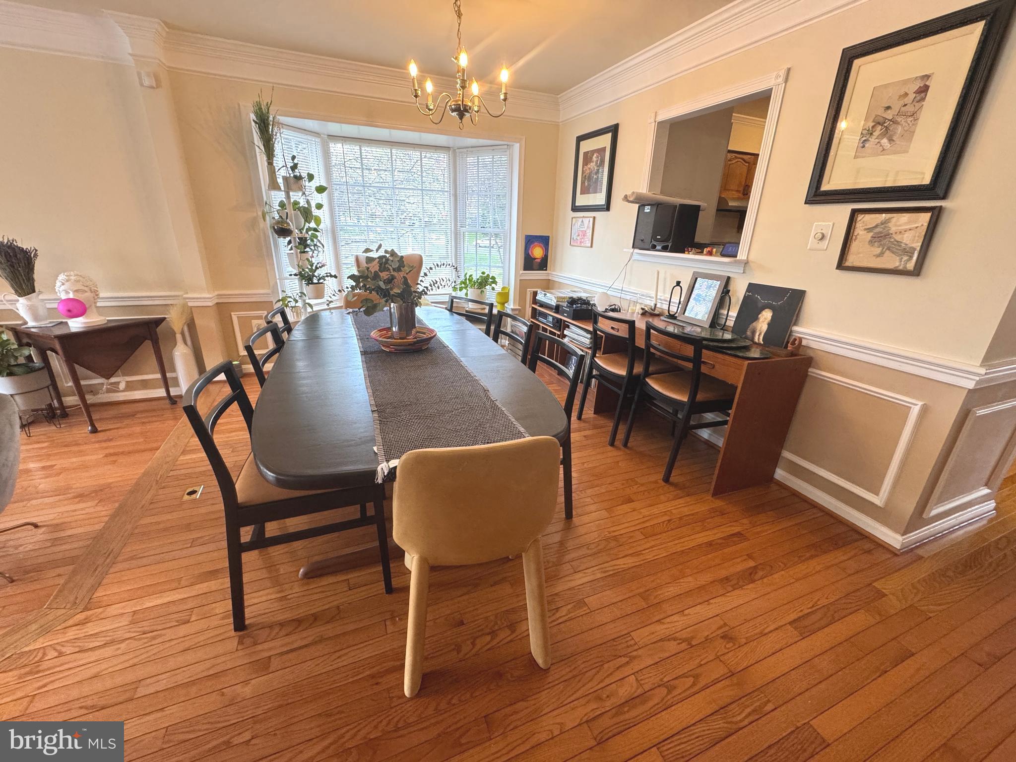 8732 Stone Hill Place Springfield, VA 22153 - Photo 6 of 28 a view of a dining room with furniture window and wooden floor