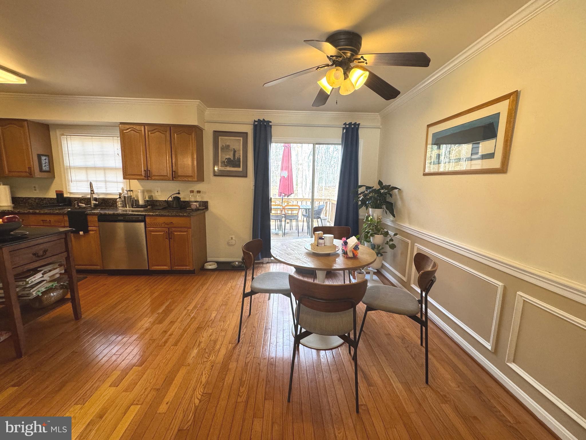 8732 Stone Hill Place Springfield, VA 22153 - Photo 9 of 28 a view of a dining room with furniture window and wooden floor