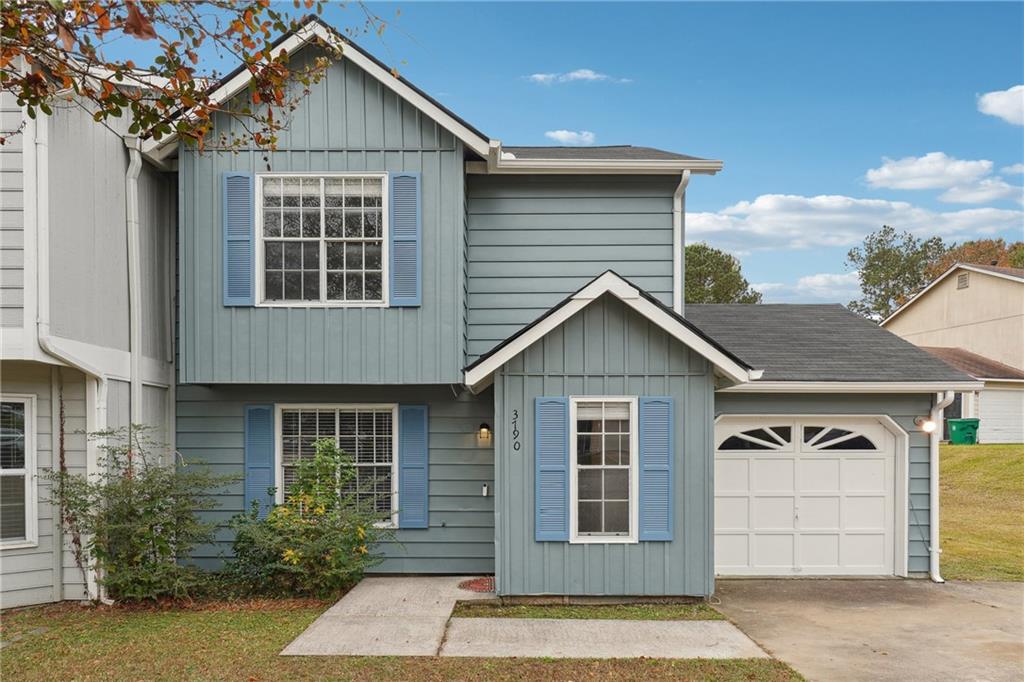 3790 Reston Lane Decatur, GA 30034 - Photo 1 of 1 a front view of a house with a yard and garage