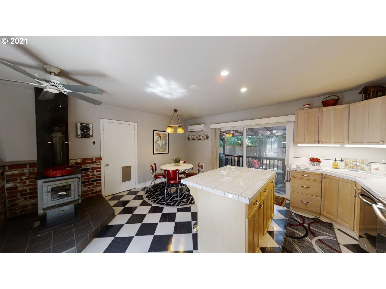 555 River Loop 1 Eugene, OR 97404 - Photo 17 of 28 a kitchen with a sink a stove a refrigerator a dining table and chairs
