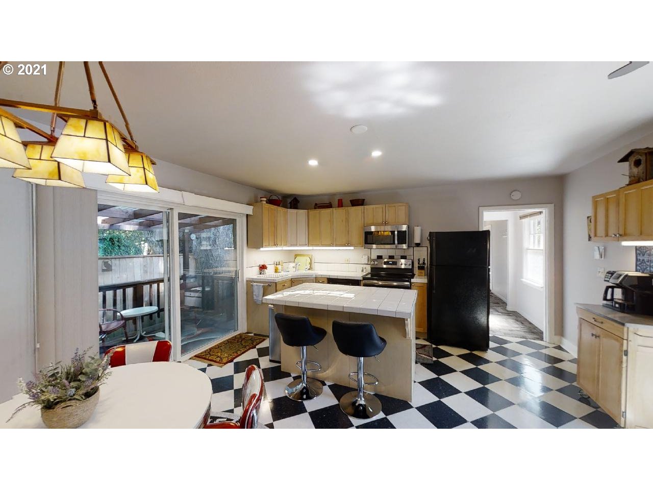 555 River Loop 1 Eugene, OR 97404 - Photo 18 of 28 a living room with a sink and a flat screen tv