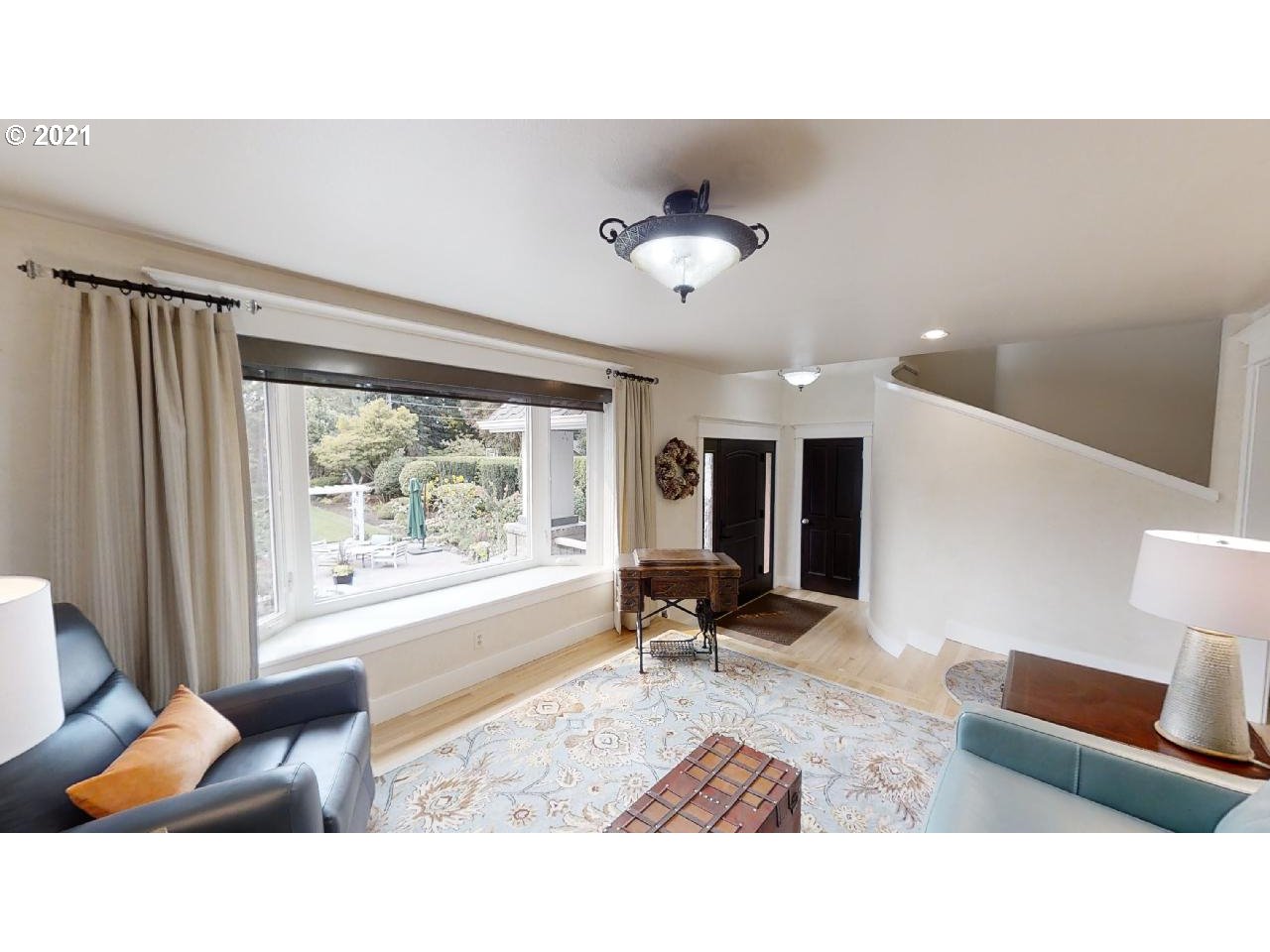 555 River Loop 1 Eugene, OR 97404 - Photo 3 of 28 a living room with furniture and a large window