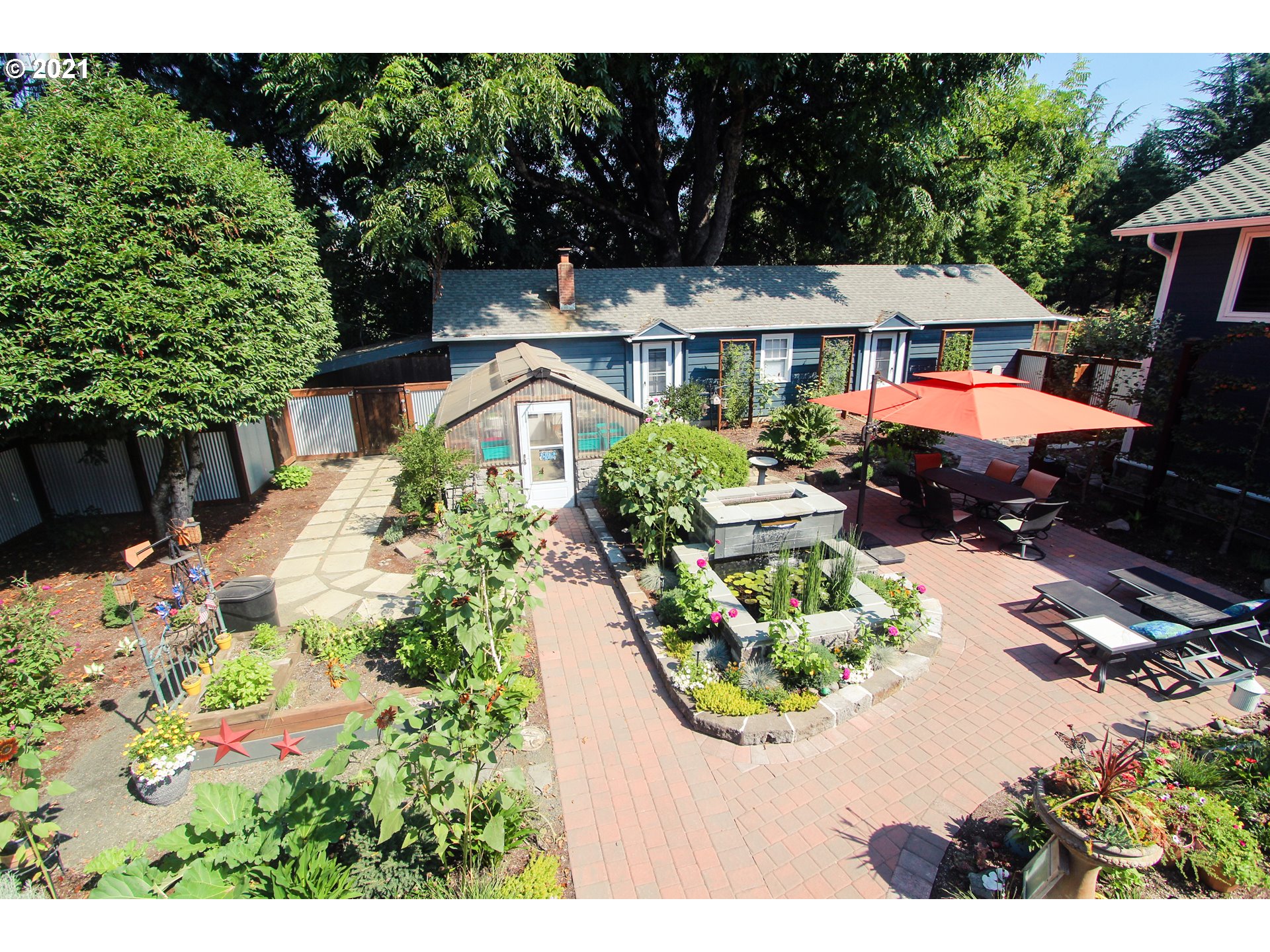 555 River Loop 1 Eugene, OR 97404 - Photo 23 of 28 a view of a house with a yard and garden