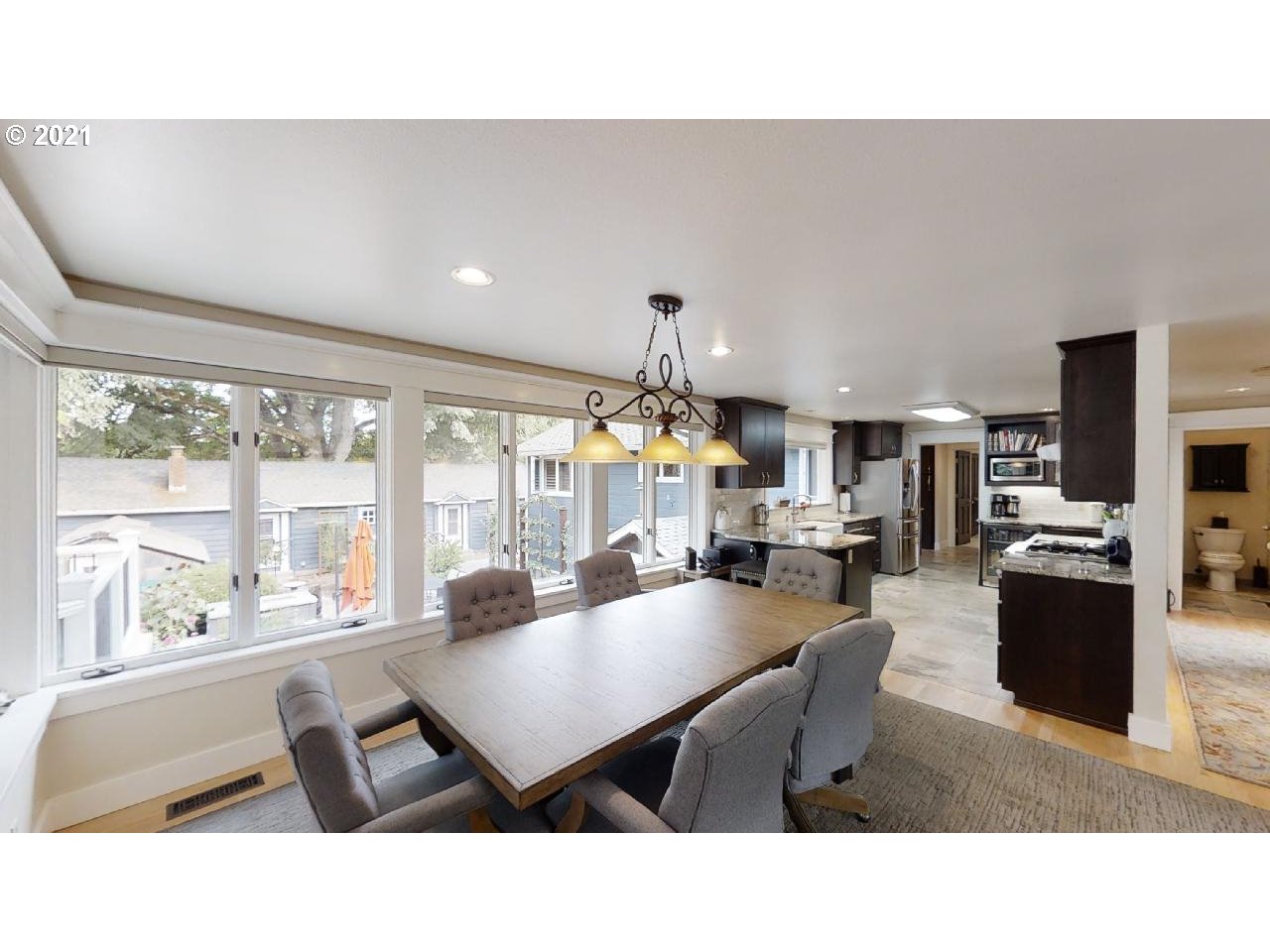 555 River Loop 1 Eugene, OR 97404 - Photo 6 of 28 a living room with furniture a flat screen tv and a large window