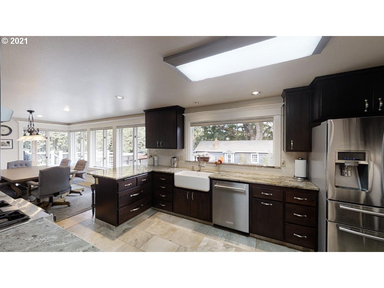 555 River Loop 1 Eugene, OR 97404 - Photo 9 of 28 a kitchen with granite countertop a sink dishwasher stove and refrigerator