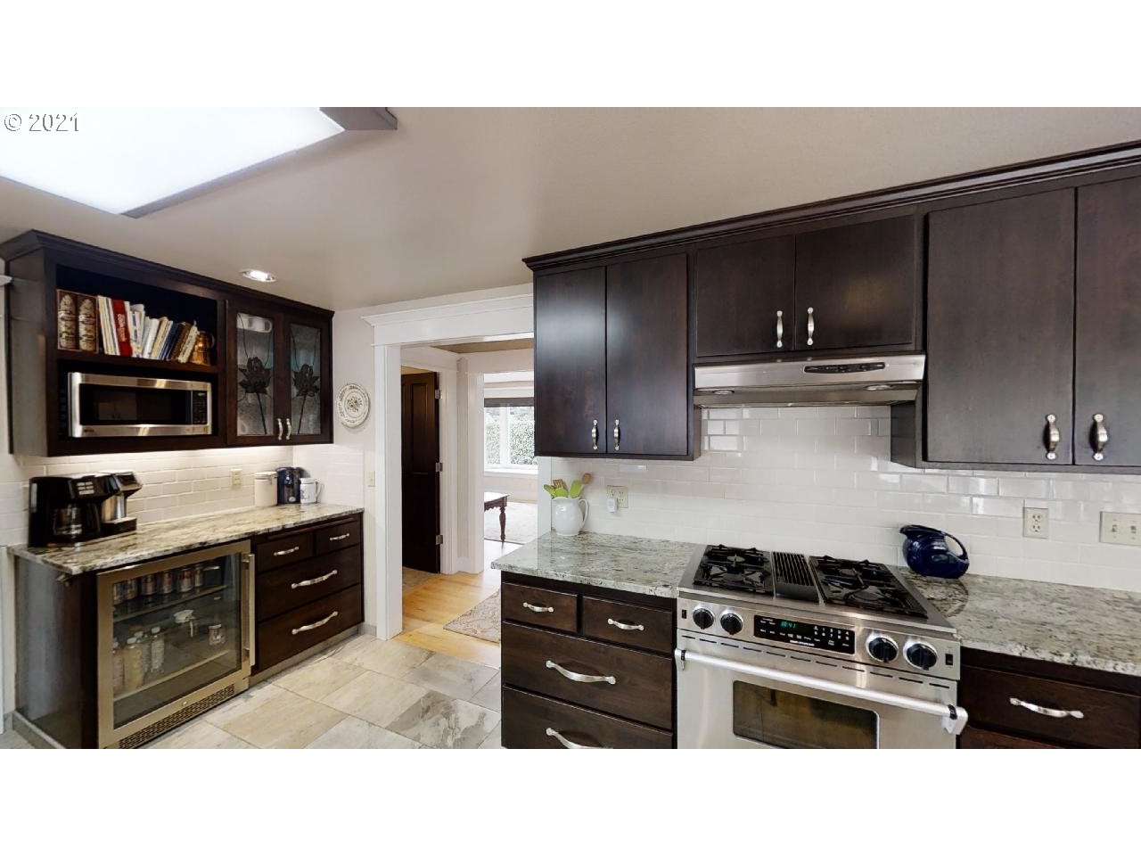 555 River Loop 1 Eugene, OR 97404 - Photo 10 of 28 a kitchen with stainless steel appliances wooden cabinets and stove