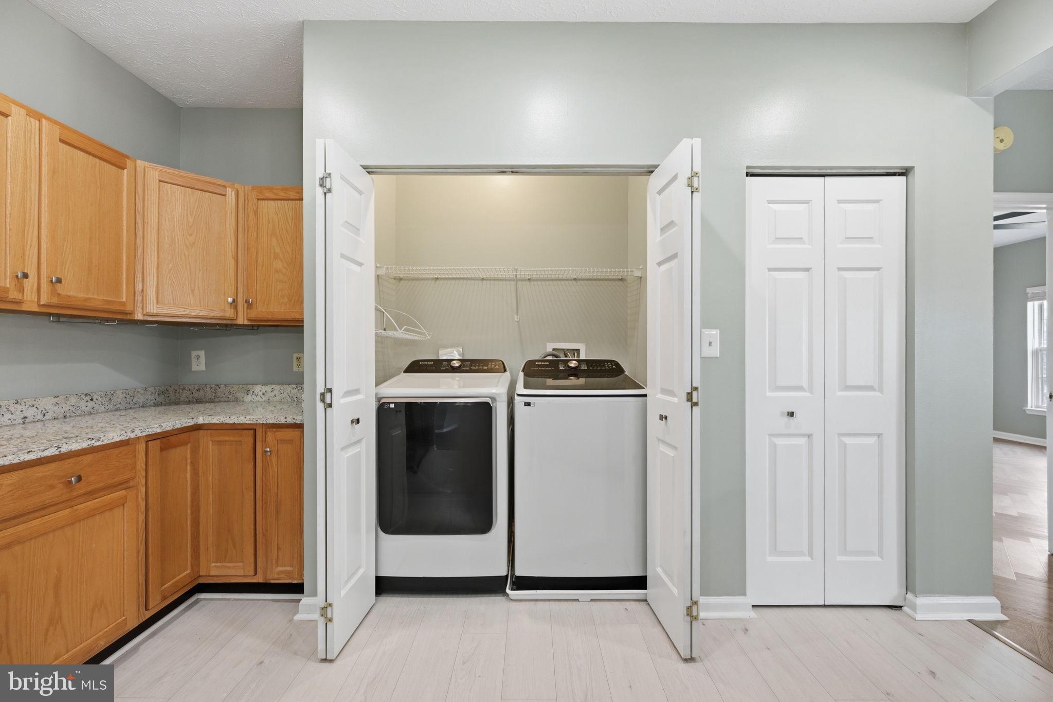 2402 Chestnut Terrace Court, Unit 202 Odenton, MD 21113 - Photo 19 of 24 a utility room with dryer and washer