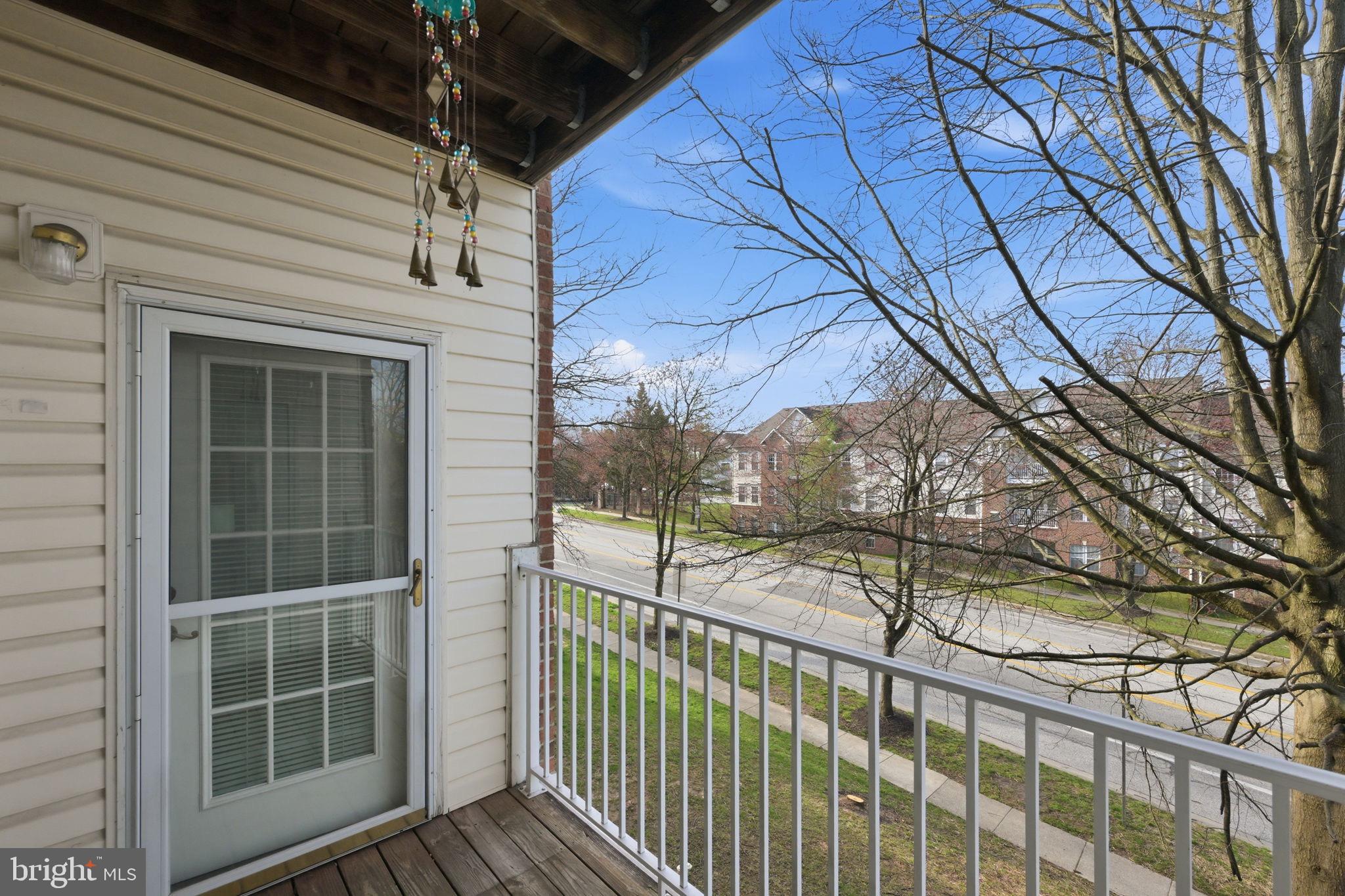 2402 Chestnut Terrace Court, Unit 202 Odenton, MD 21113 - Photo 20 of 24 a view of a balcony with a potted plant