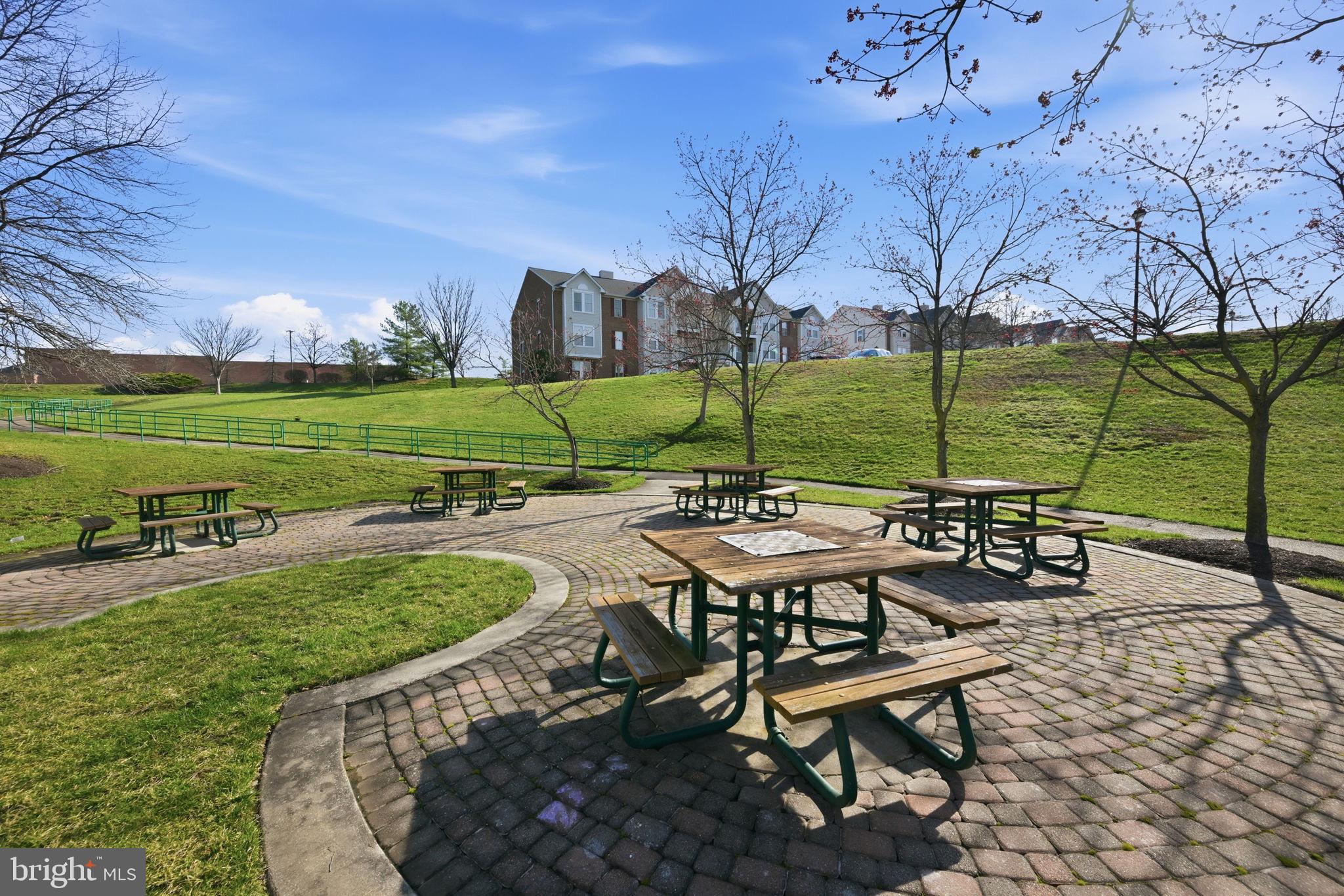 2402 Chestnut Terrace Court, Unit 202 Odenton, MD 21113 - Photo 21 of 24 a view of a table and chairs in the patio