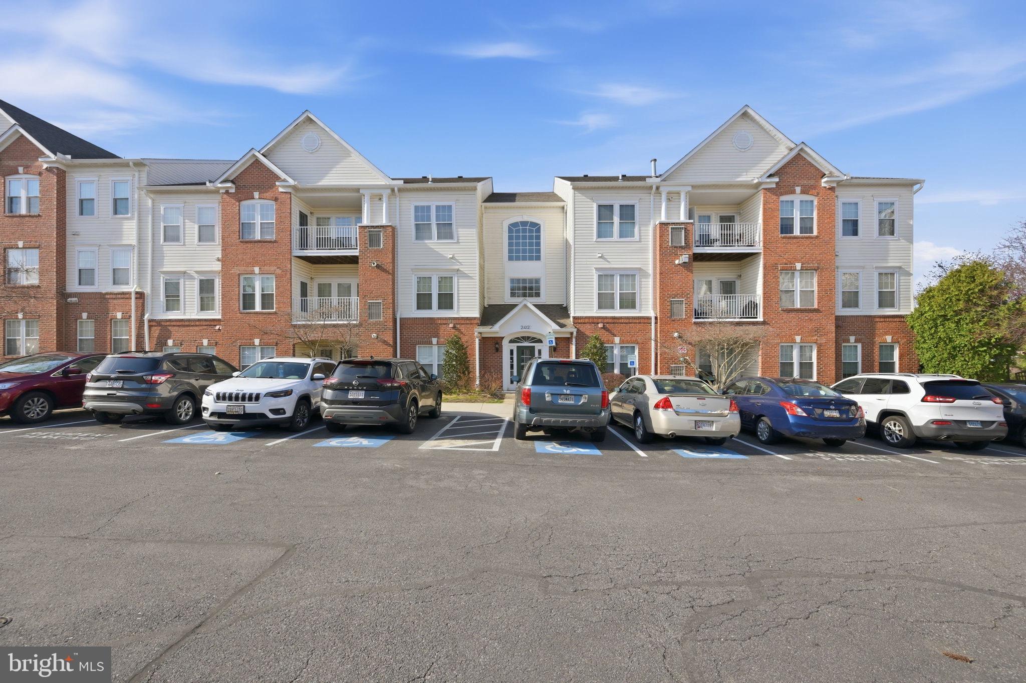 2402 Chestnut Terrace Court, Unit 202 Odenton, MD 21113 - Photo 23 of 24 a view of a cars parked in front of a building