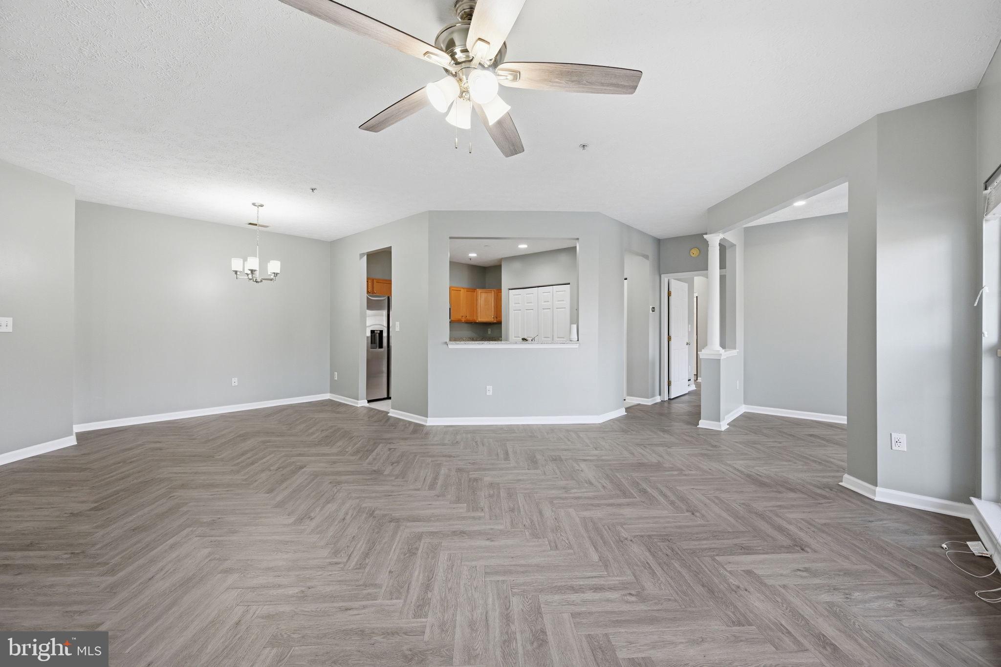 2402 Chestnut Terrace Court, Unit 202 Odenton, MD 21113 - Photo 24 of 24 a view of an empty room and kitchen view