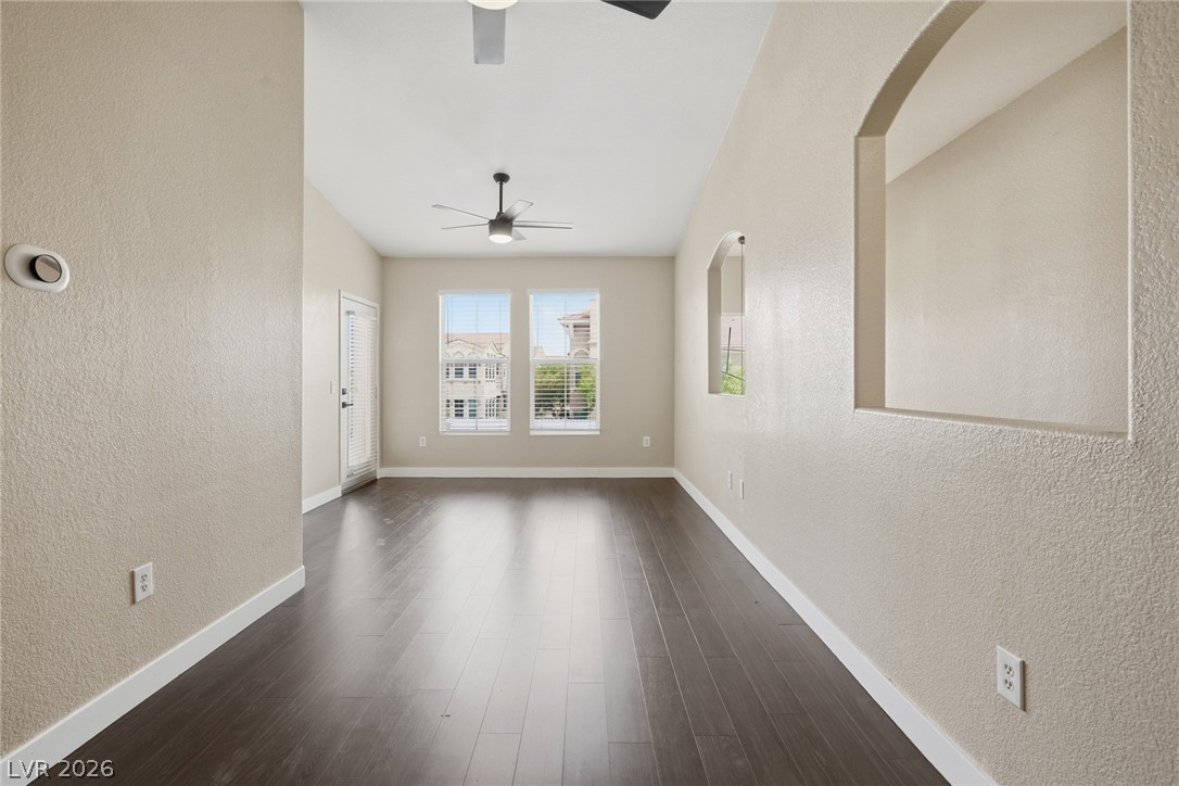 10550 West Alexander Road, Unit 2177 Las Vegas, NV 89129 - Photo 5 of 19 This expansive room offers abundant natural light and versatile living space for various arrangements.