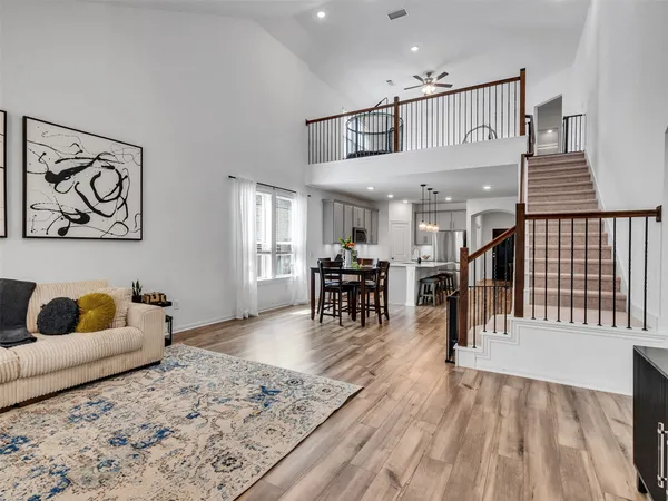 a view of a livingroom with furniture and staircase