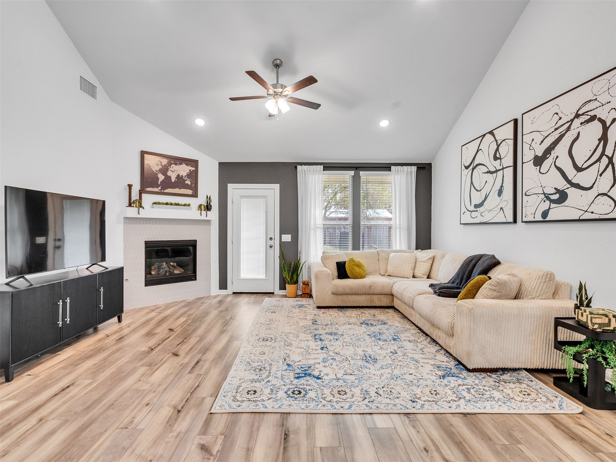 25832 Rugosa Drive Magnolia, TX 77355 - Photo 6 of 50 Lovely living room with a fireplace and plenty of space for your desired furniture layout.