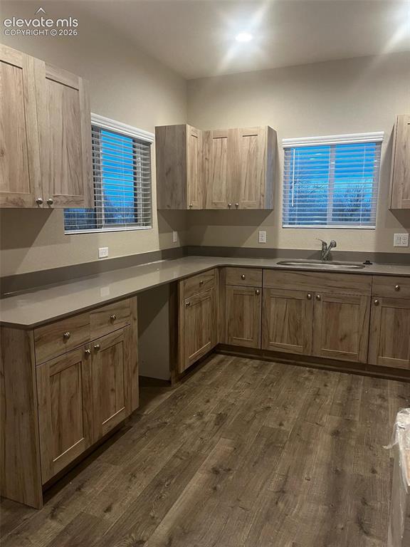 6644 Rawhide Rdg View Colorado Springs, CO 80915 - Photo 11 of 26 a large kitchen with wooden cabinets and a sink