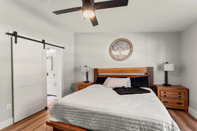 a bedroom with a bed and a table