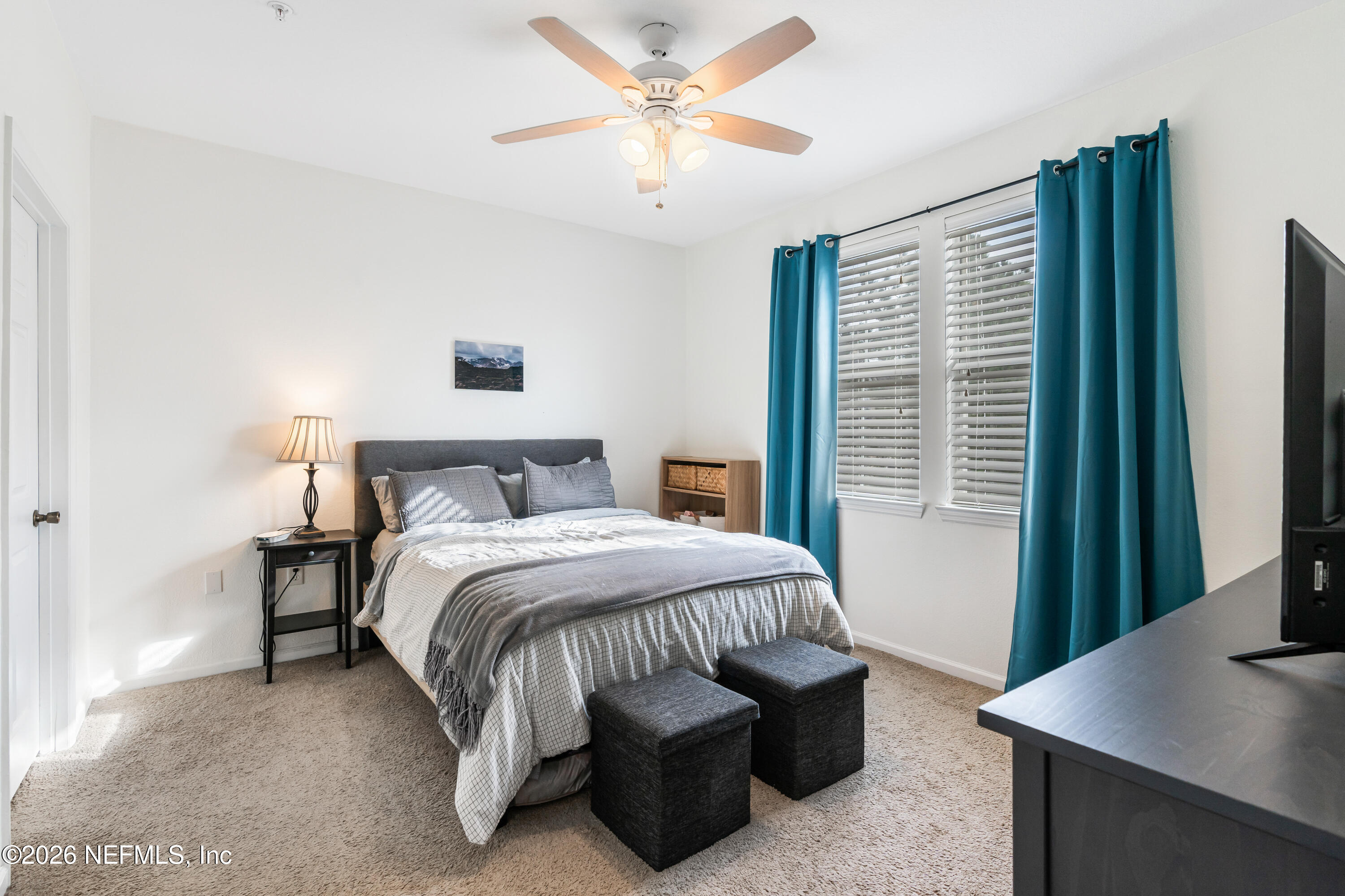 8550 Touchton Road, Unit 1034 Jacksonville, FL 32216 - Photo 11 of 30 a bed room with a bed and a window