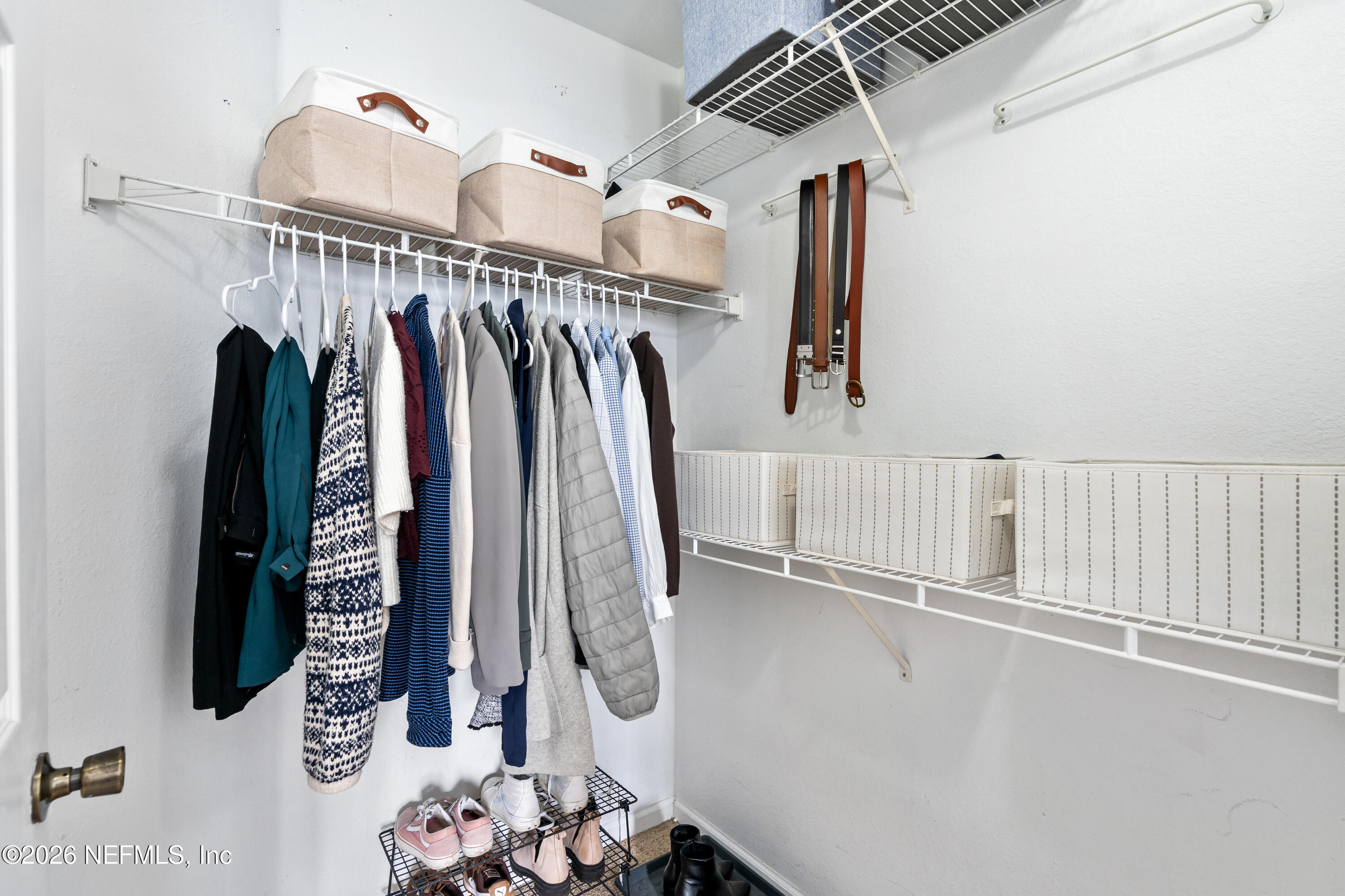 8550 Touchton Road, Unit 1034 Jacksonville, FL 32216 - Photo 13 of 30 a view of walk in closet with clothes and shoes