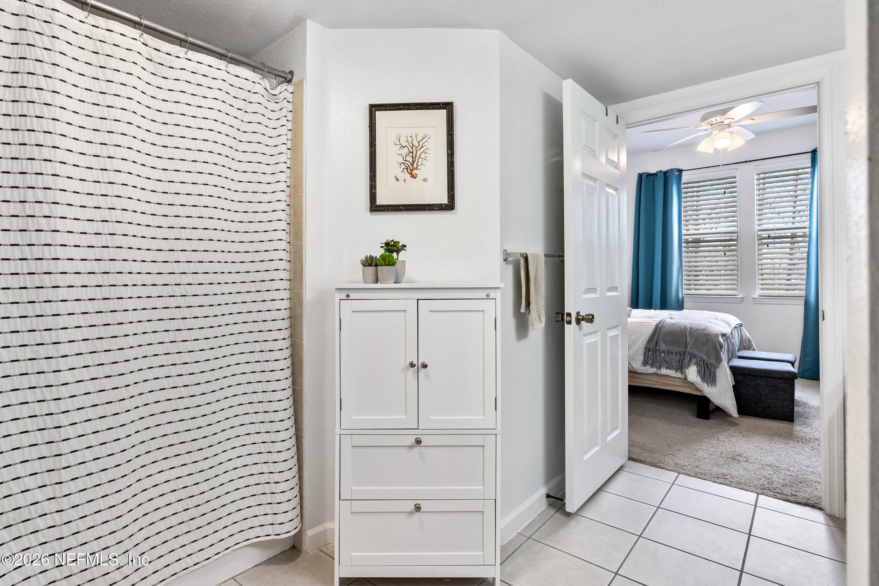 8550 Touchton Road, Unit 1034 Jacksonville, FL 32216 - Photo 16 of 30 a bedroom with a bed and a view of bedroom