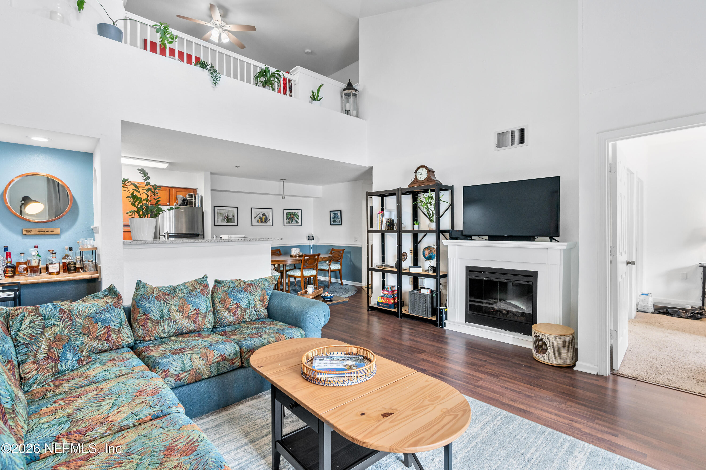 8550 Touchton Road, Unit 1034 Jacksonville, FL 32216 - Photo 18 of 30 a living room with furniture and a wooden floor