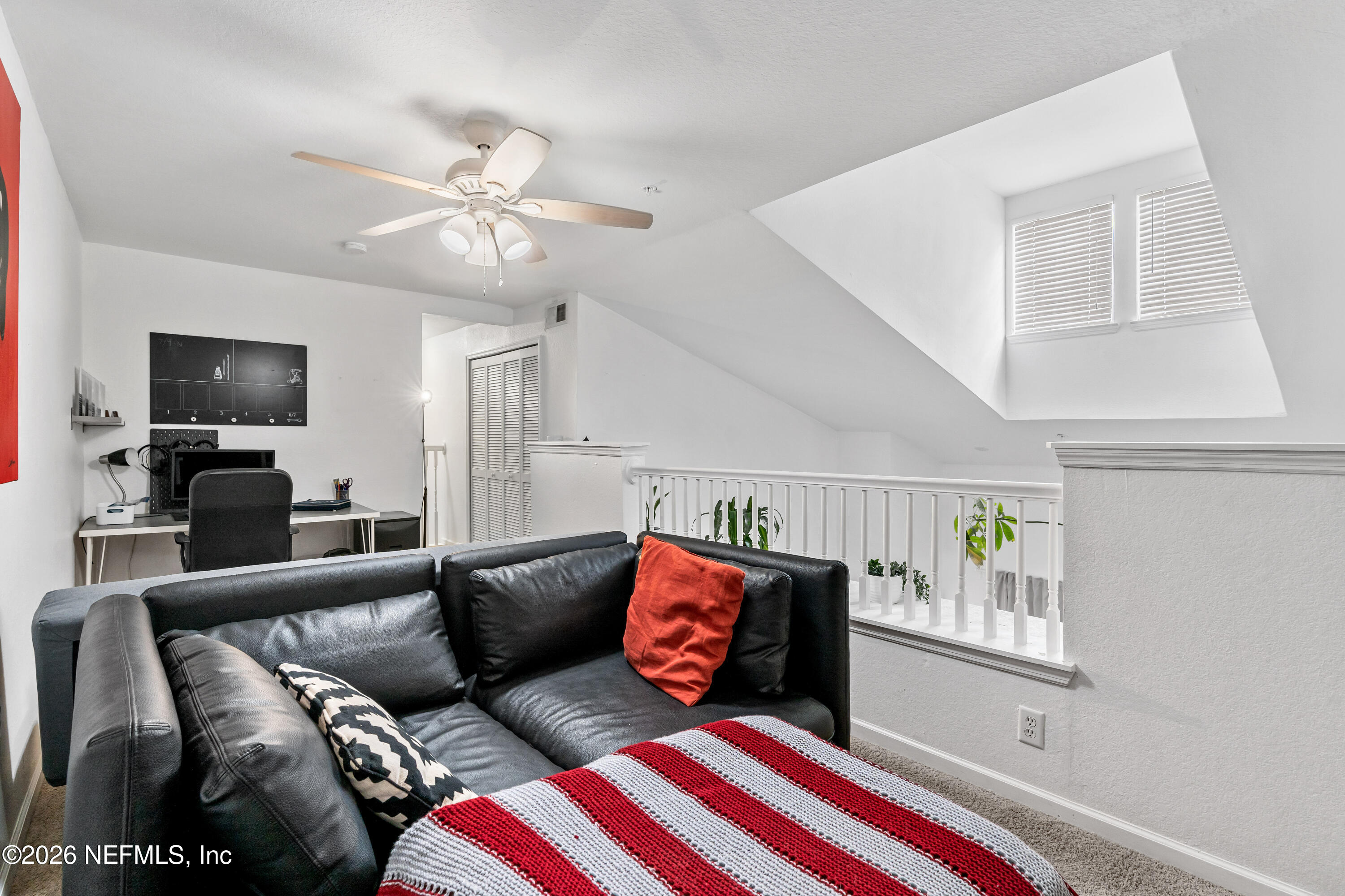 8550 Touchton Road, Unit 1034 Jacksonville, FL 32216 - Photo 23 of 30 a living room with furniture and a flat screen tv